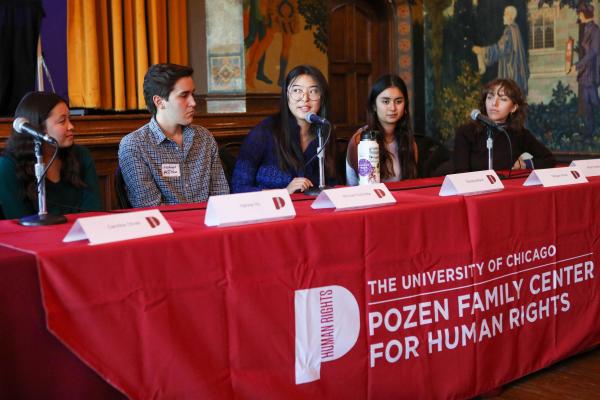 Photograph of student interns speaking on a panel